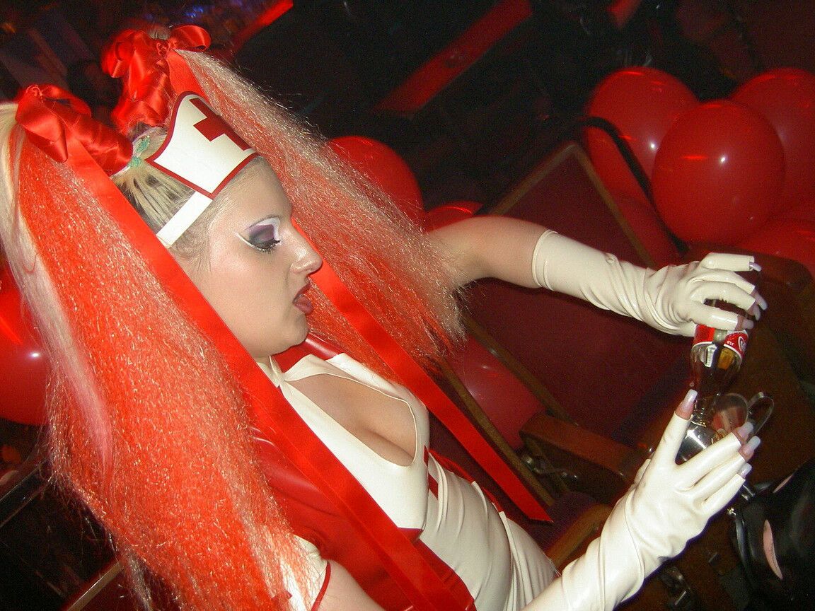 16P Latex attired nurse Joanne Lafontaine uses Darkwing Zero as her slave