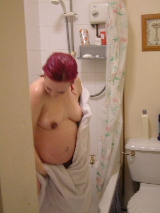 12P Pregnant redhead takes a shower while being secretly recorded on spy cam