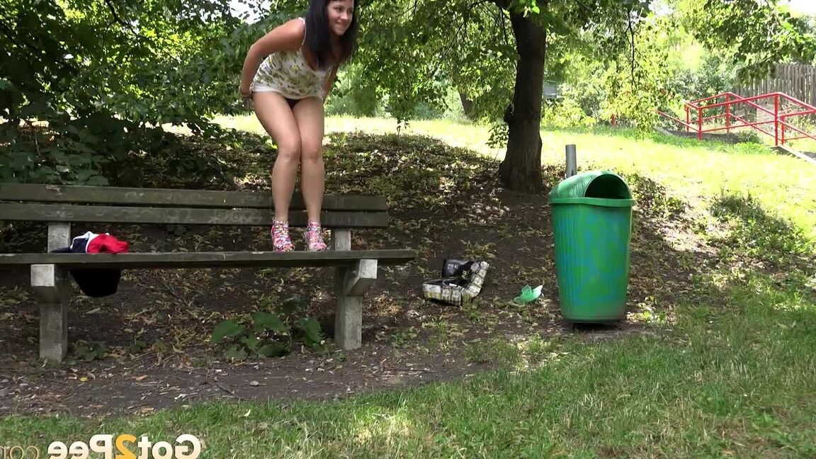 15P Hot brunette Tanika squats with her panties pulled down to pee under a tree