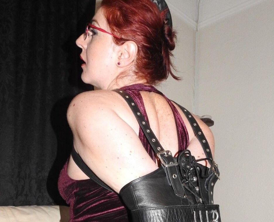 16P Natural redhead is placed in a straight jacket with her glasses on