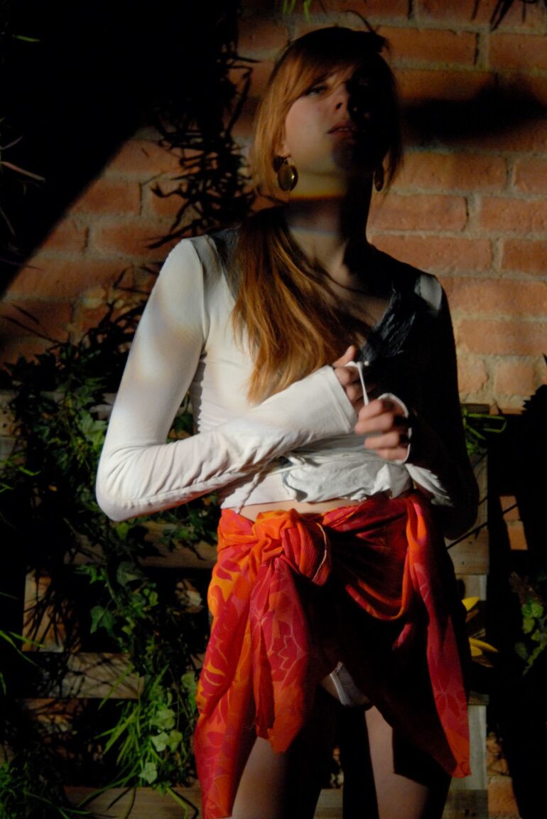 12P Natural redhead Lina plays with her ponytail while exposing her upskirt undies