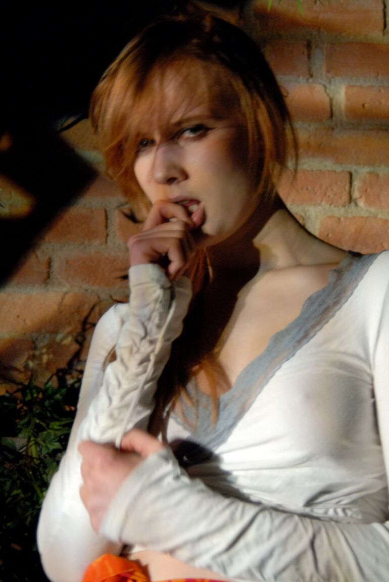 12P Natural redhead Lina plays with her ponytail while exposing her upskirt undies
