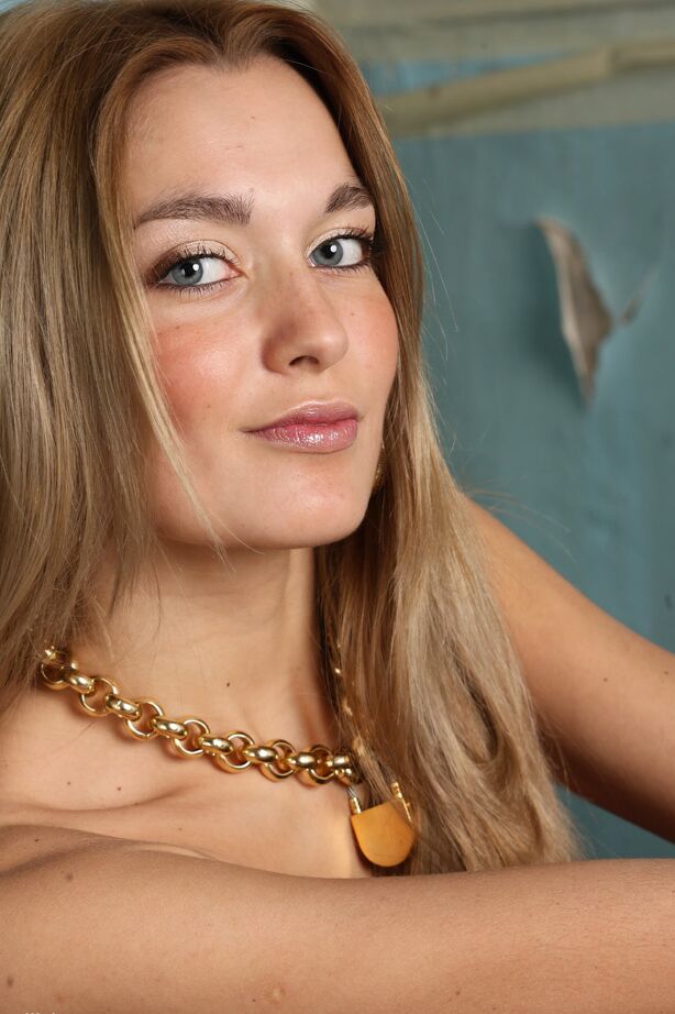 12P Teen model Sweet Lilya uncovers her flat chest before showing her ass and twat