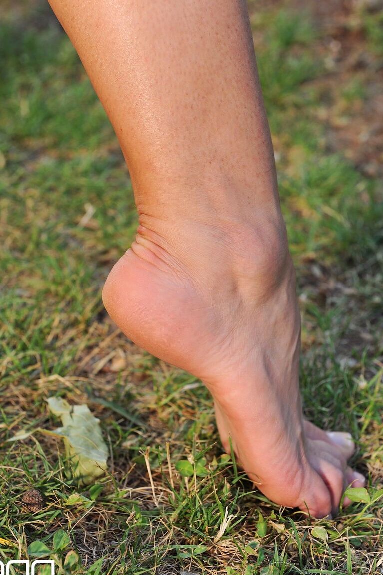 21P MILF Eve Angel teases with her hot body & feet while practicing archery