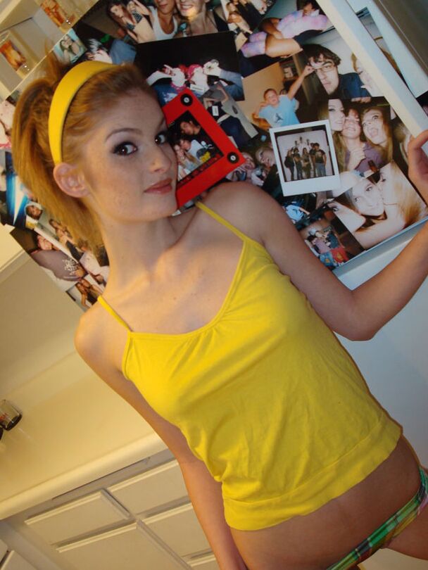 21P Skinny redhead honey Faye Regan shows her natural tits and round bum in a solo