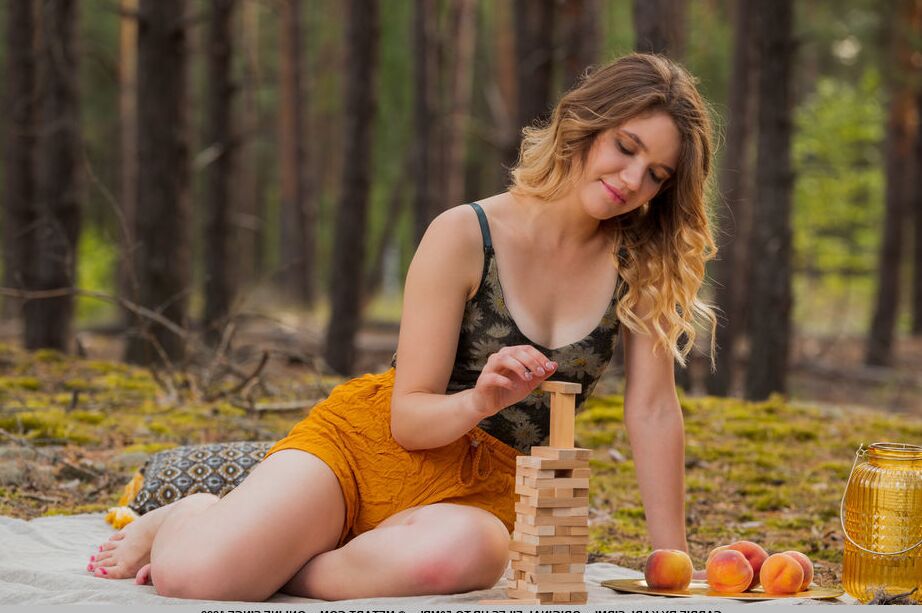 18P Beautiful young girl Carrie gets bare naked while picnicking in the woods