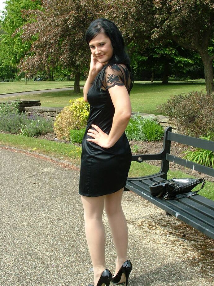 16P Clothed brunette female models her new black pumps in hosiery