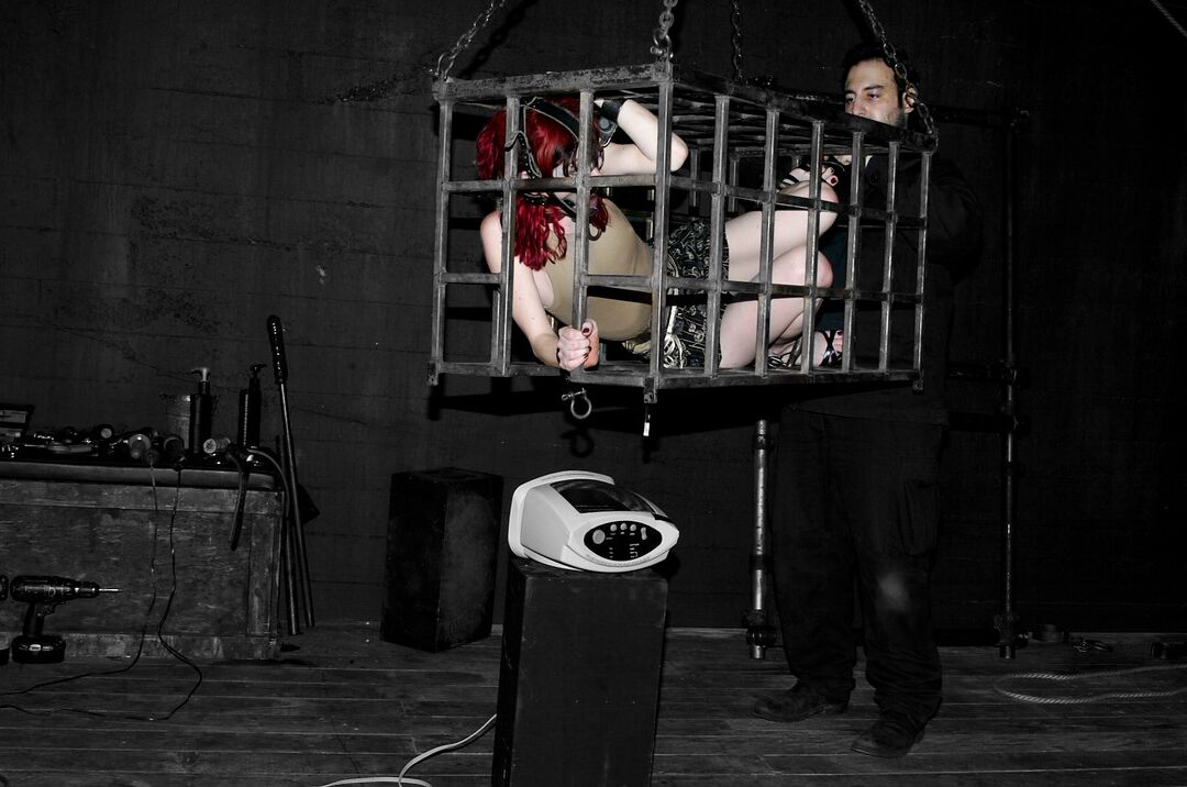 17P Redhead slave Arachnia Webb gets tortured while sitting in the cage