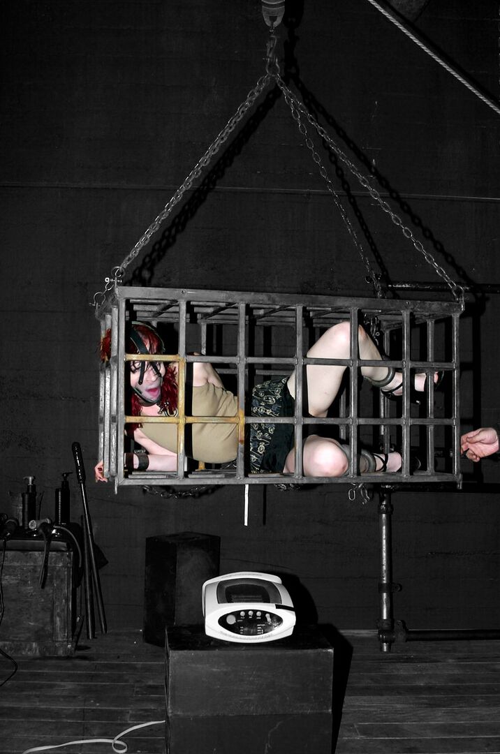 17P Redhead slave Arachnia Webb gets tortured while sitting in the cage