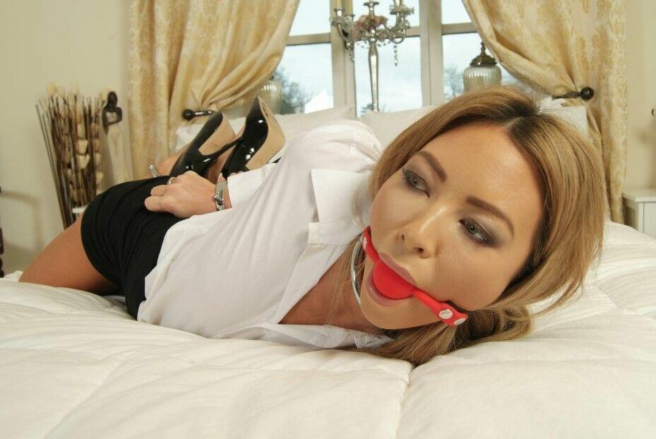 16P Hot UK girl Natalia Forrest sports a ball gag while restrained with cuffs
