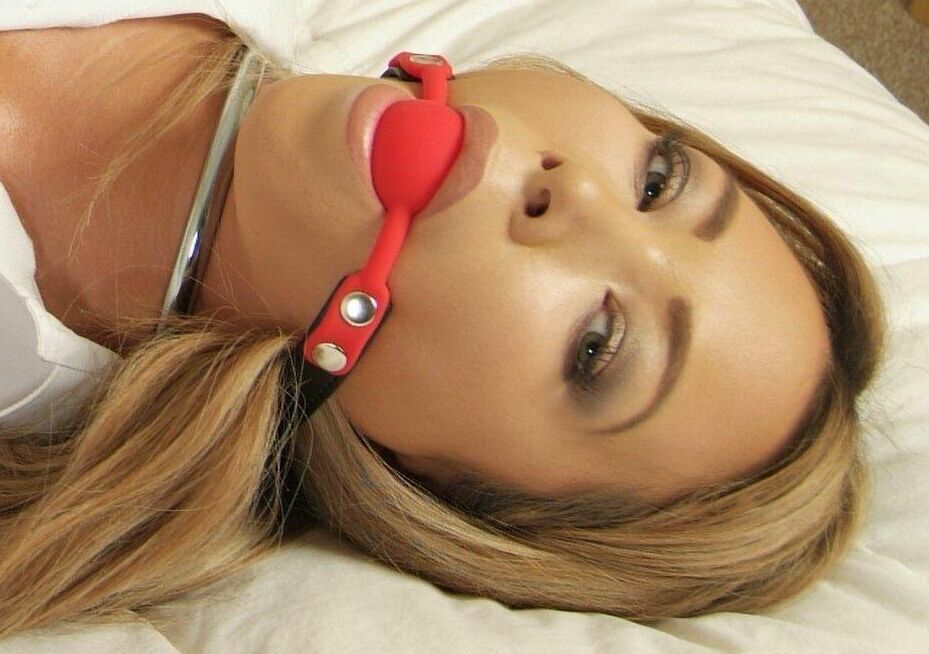 16P Hot UK girl Natalia Forrest sports a ball gag while restrained with cuffs