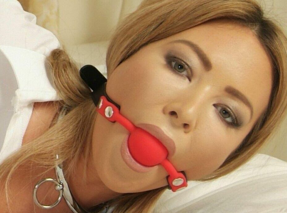 16P Hot UK girl Natalia Forrest sports a ball gag while restrained with cuffs