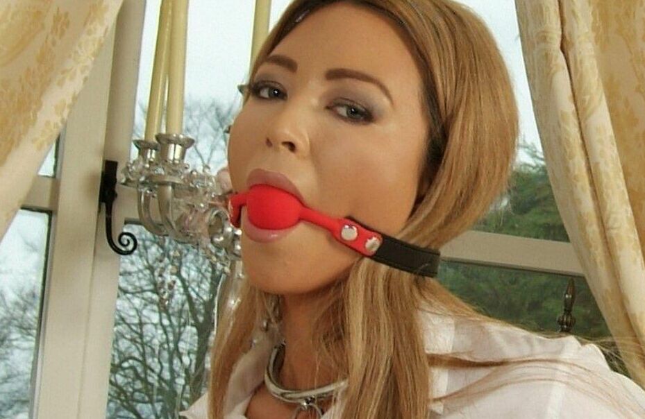 16P Hot UK girl Natalia Forrest sports a ball gag while restrained with cuffs