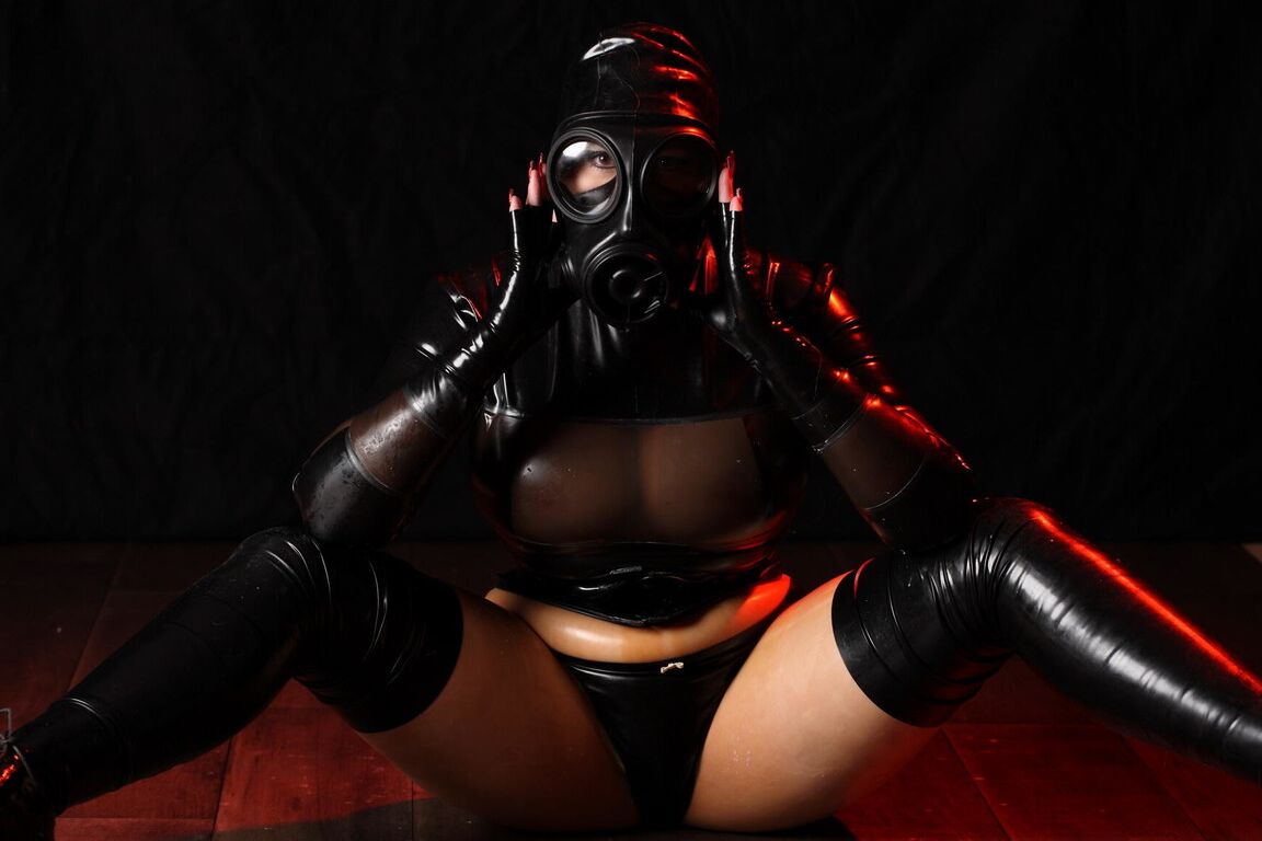 16P Solo model Avengelique poses in latex clothing and a gas mask