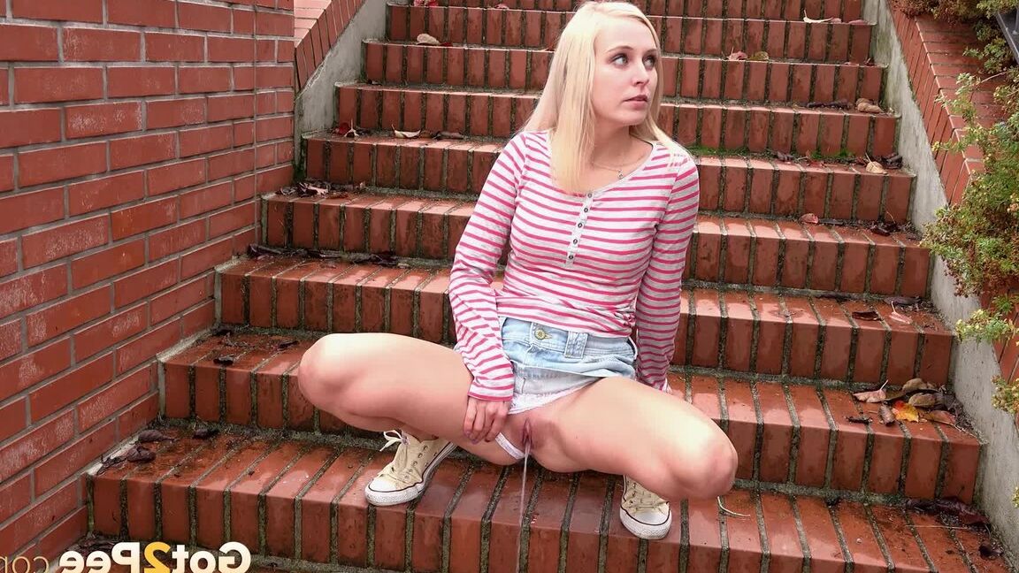15P Blonde teen Debora pulls aside cotton panties to pee on the steps in public