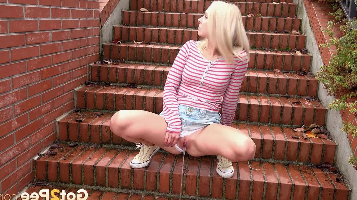 15P Blonde teen Debora pulls aside cotton panties to pee on the steps in public