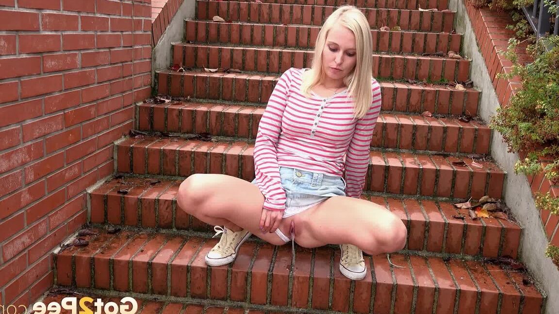 15P Blonde teen Debora pulls aside cotton panties to pee on the steps in public