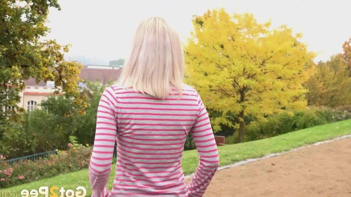 15P Blonde teen Debora pulls aside cotton panties to pee on the steps in public