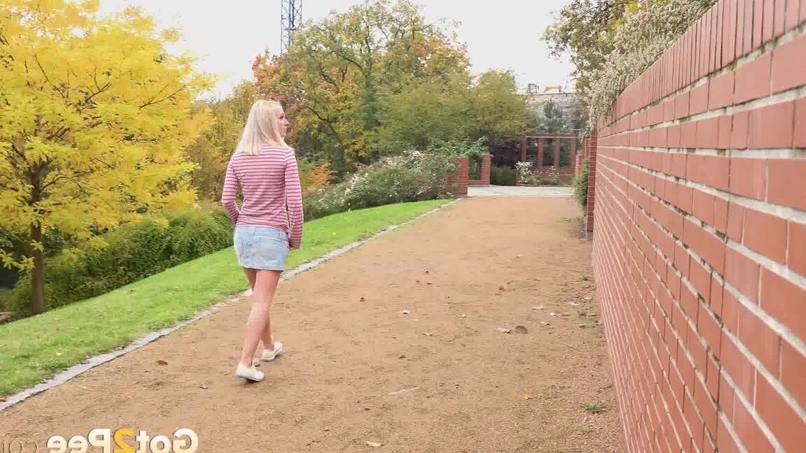 15P Blonde teen Debora pulls aside cotton panties to pee on the steps in public
