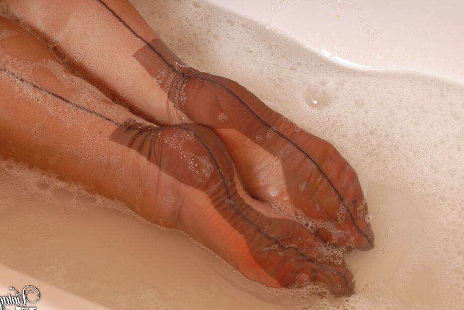 12P Mature woman Red takes a bath in a garter belt and backseam nylons