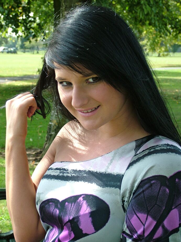 16P Dark haired girl flashes stocking tops while adjusting her pumps on a bench