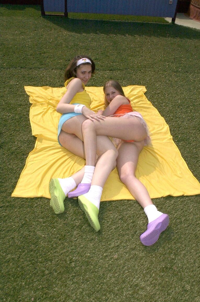 21P Naturally busty teens flash their boobs and pussies in the garden