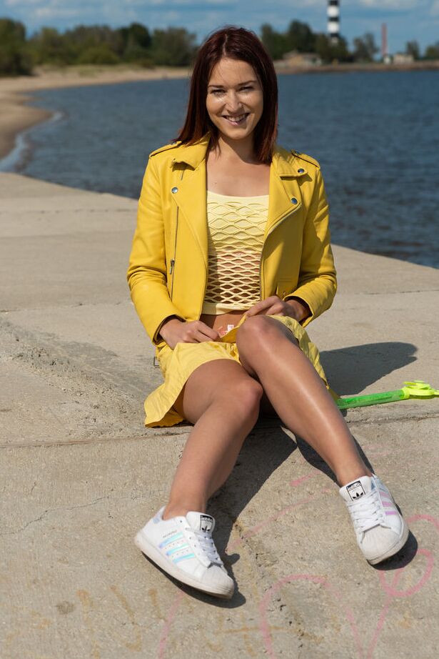 18P Sweet teen Mina divests herself of clothing to get naked by the ocean
