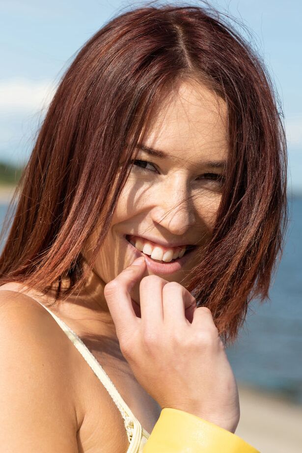 18P Sweet teen Mina divests herself of clothing to get naked by the ocean