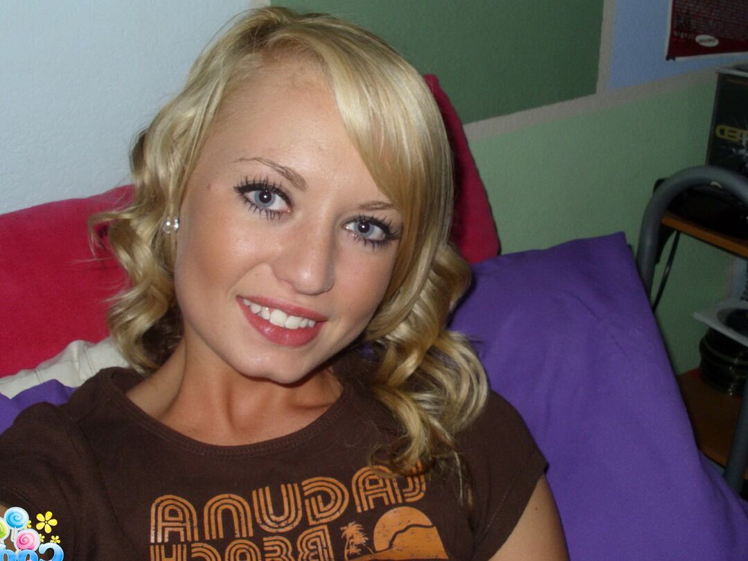 12P Cute blonde Codie Sweets takes selfies while getting butt naked on her bed