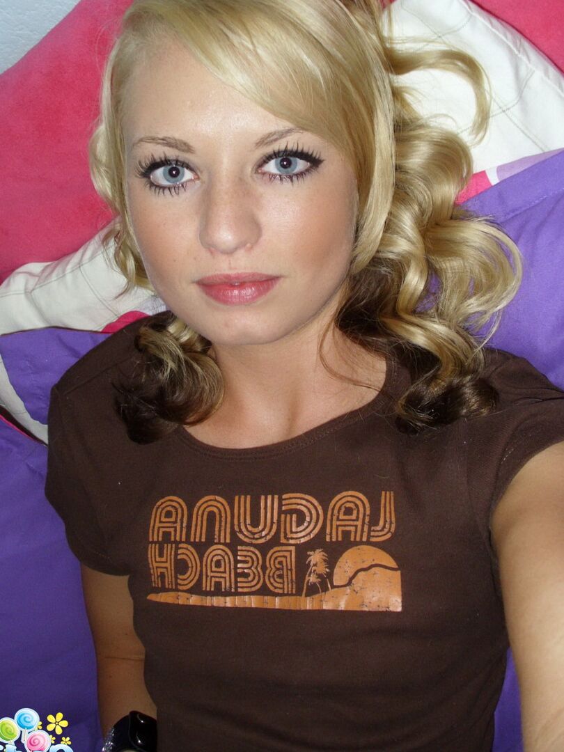 12P Cute blonde Codie Sweets takes selfies while getting butt naked on her bed