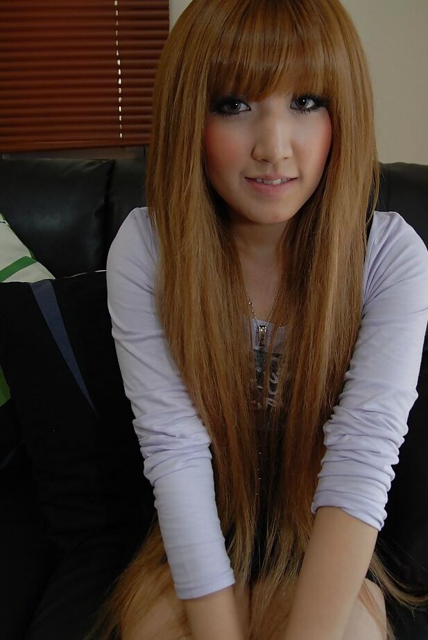 16P Seductive asian baby doll Hikari Asakawa undressing on the bed