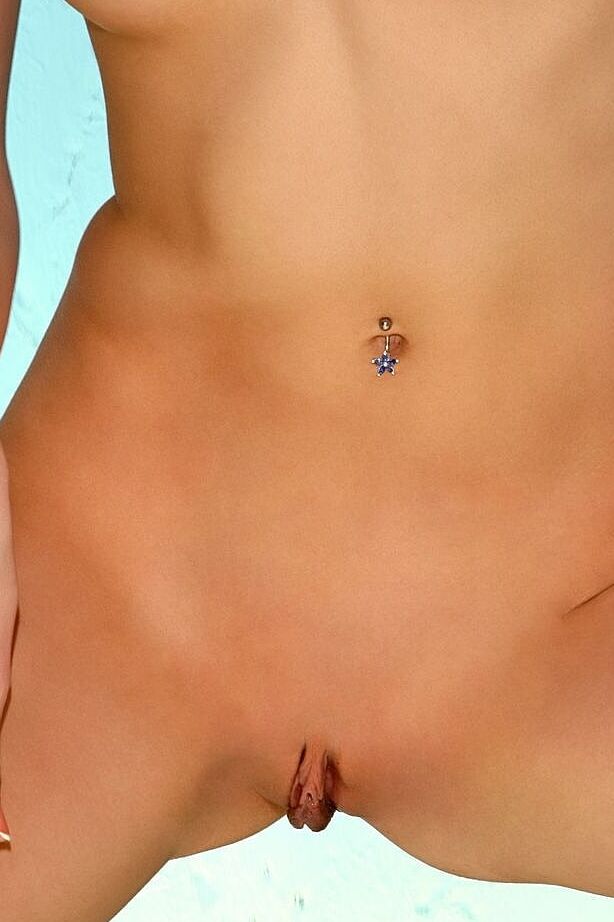 21P Gorgeous teen with tiny tits flaunts her tasty twat lips while posing naked