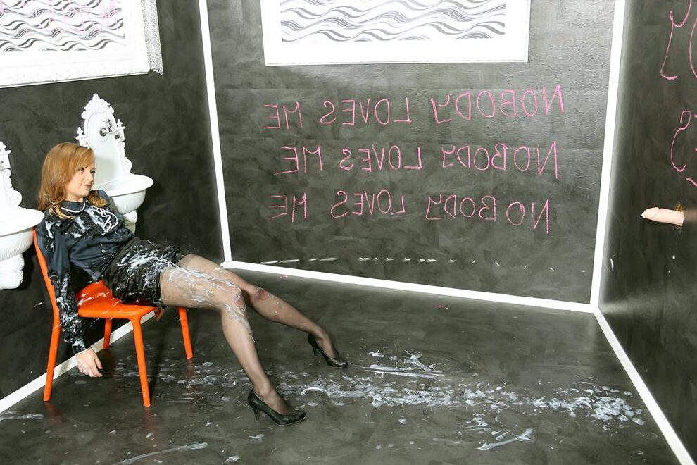 12P Clothed woman exposes her breasts while being covered in cum at a gloryhole