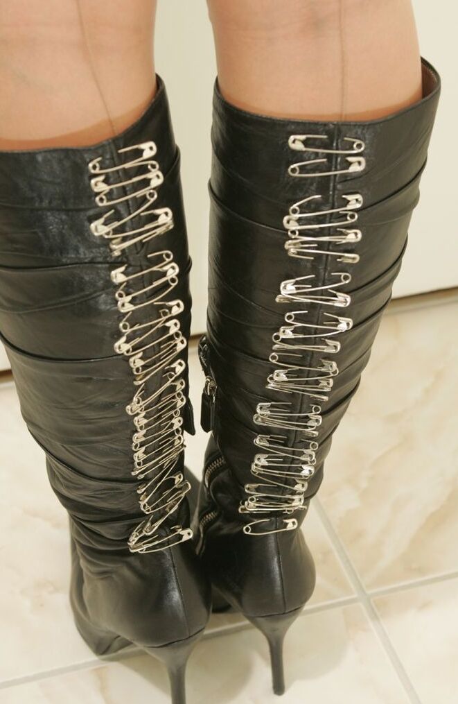 15P Solo girl adjusts her garters after taking off a red mini in nylons and boots