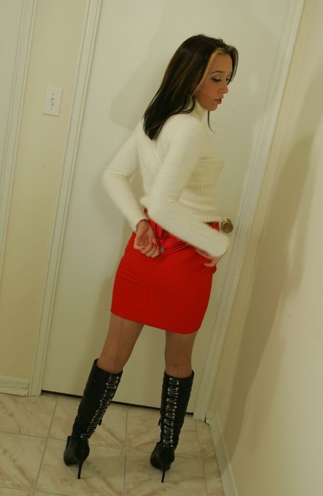 15P Solo girl adjusts her garters after taking off a red mini in nylons and boots
