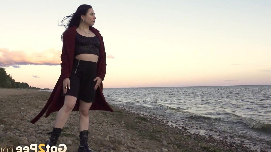 15P Dark-haired girl Alyona takes a piss while walking on a beach by herself