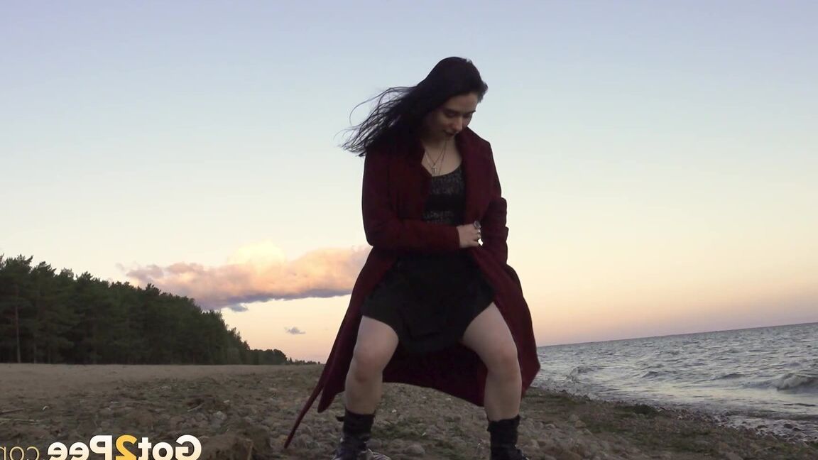 15P Dark-haired girl Alyona takes a piss while walking on a beach by herself