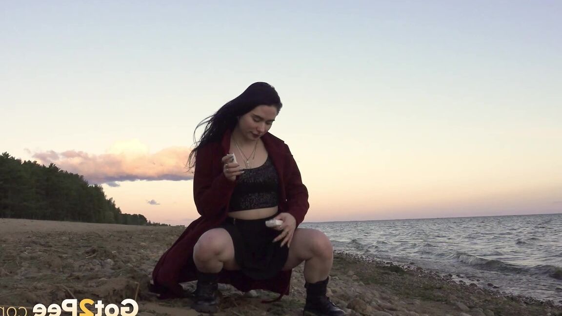 15P Dark-haired girl Alyona takes a piss while walking on a beach by herself