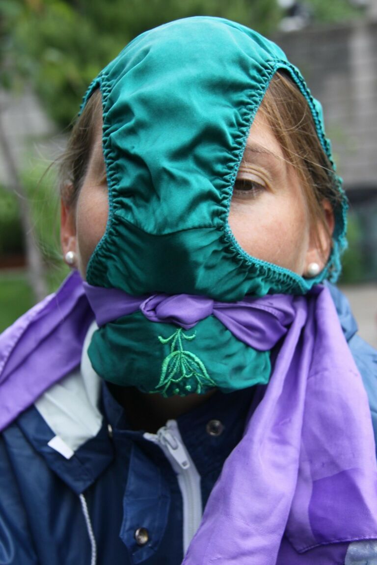 16P Caucasian woman is tied to a table in a yard with panties over her face