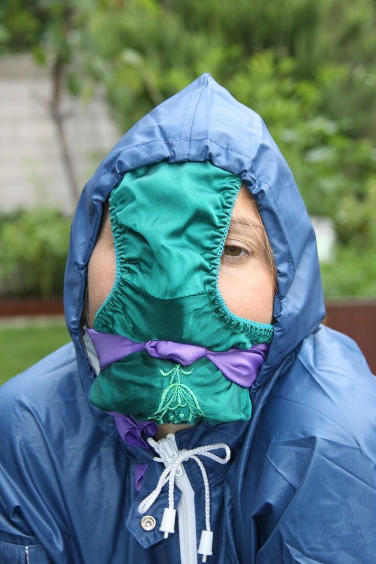 16P Caucasian woman is tied to a table in a yard with panties over her face