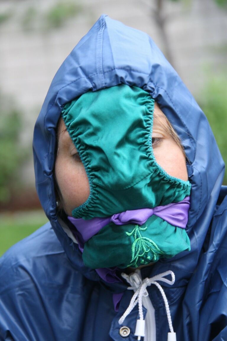 16P Caucasian woman is tied to a table in a yard with panties over her face