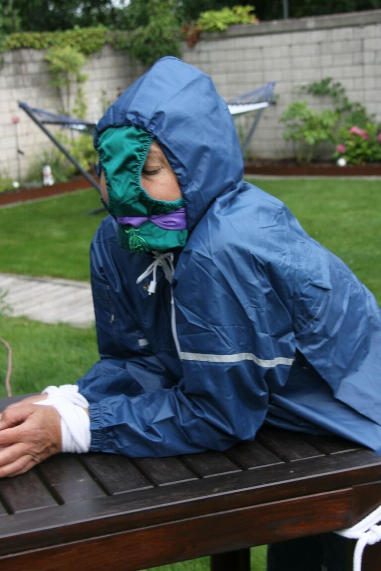 16P Caucasian woman is tied to a table in a yard with panties over her face