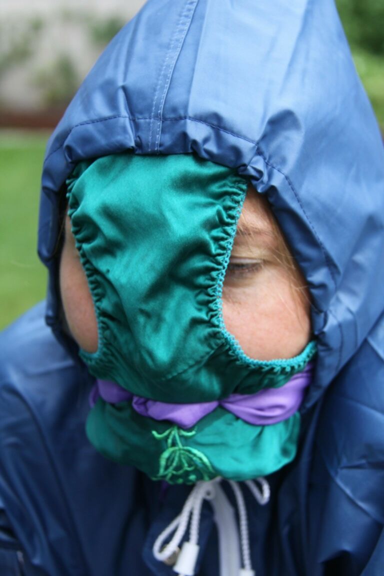 16P Caucasian woman is tied to a table in a yard with panties over her face