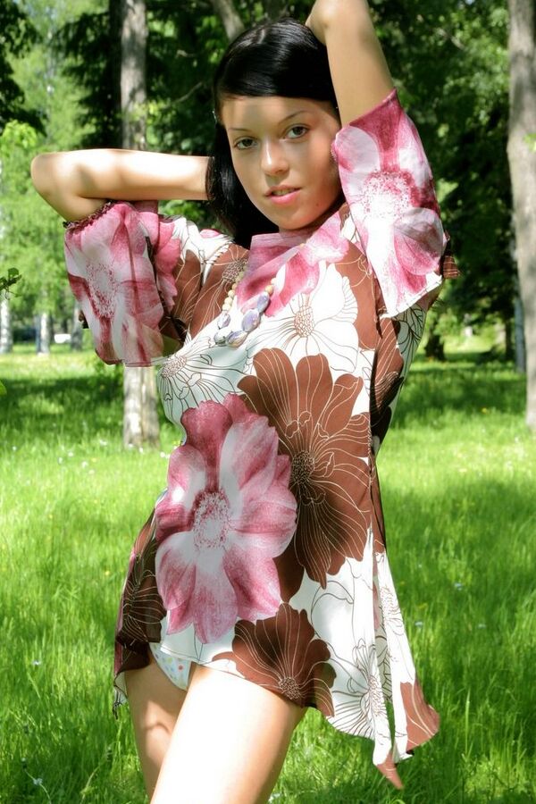 15P Young looking brunette with full breasts exposes herself in a treed area