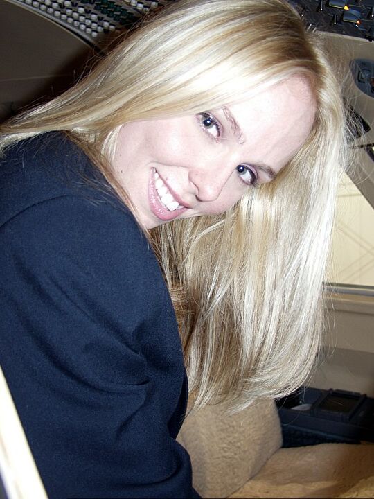 16P Blonde amateur Naughty Julie shows her tits and twat in the cockpit of a plane