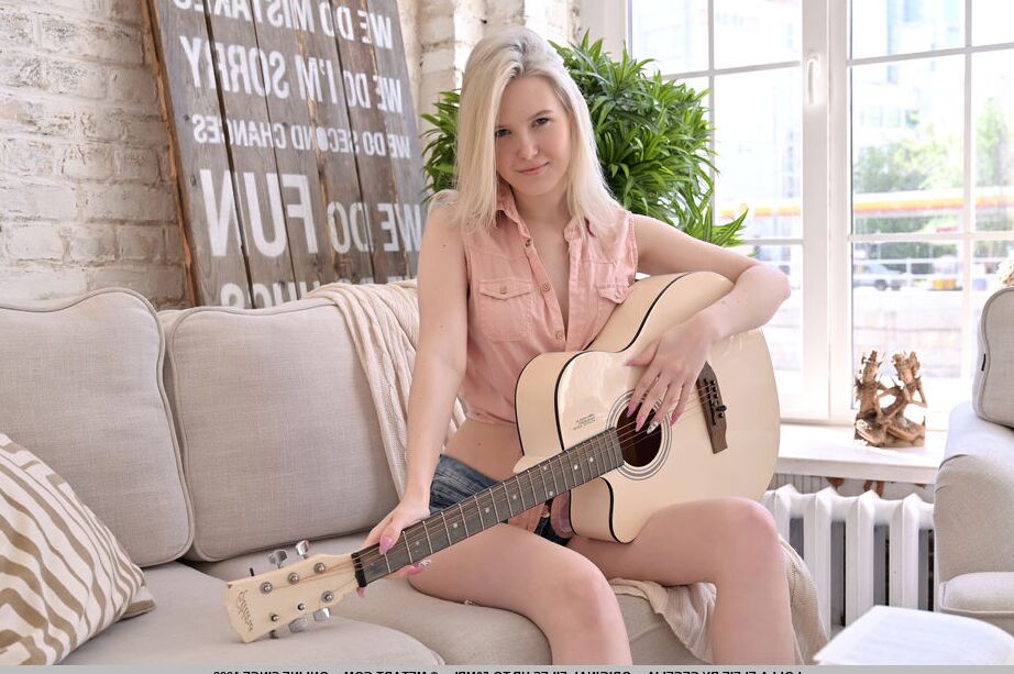 18P Cute new model Lolla Elfie keeps her nimble fingers busy, strumming her guitar