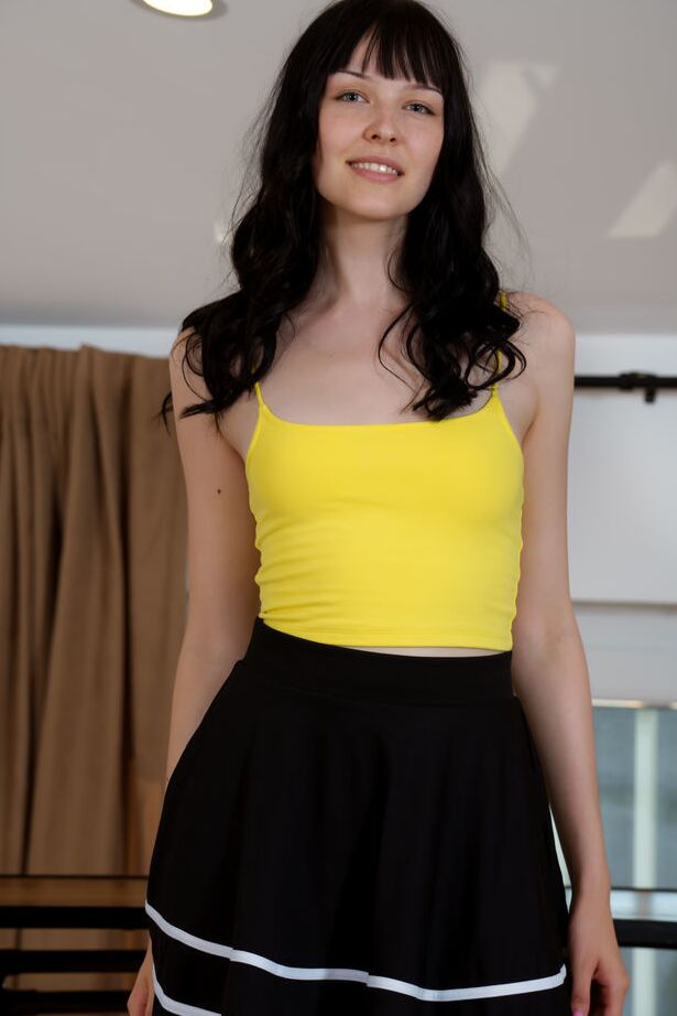 18P Long legged new model Mimi Babe teasingly lifts the hem of her skirt and gives