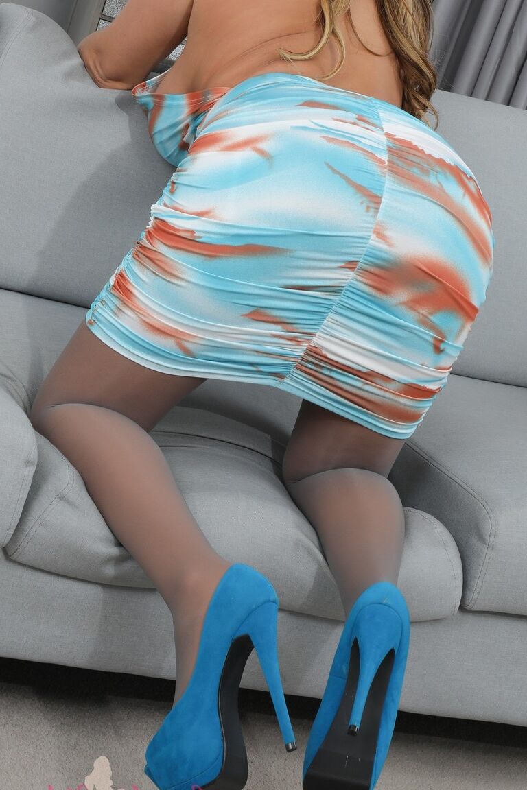 16P Kay from Layered Nylons in a sexy minidress with sheer pantyhose over