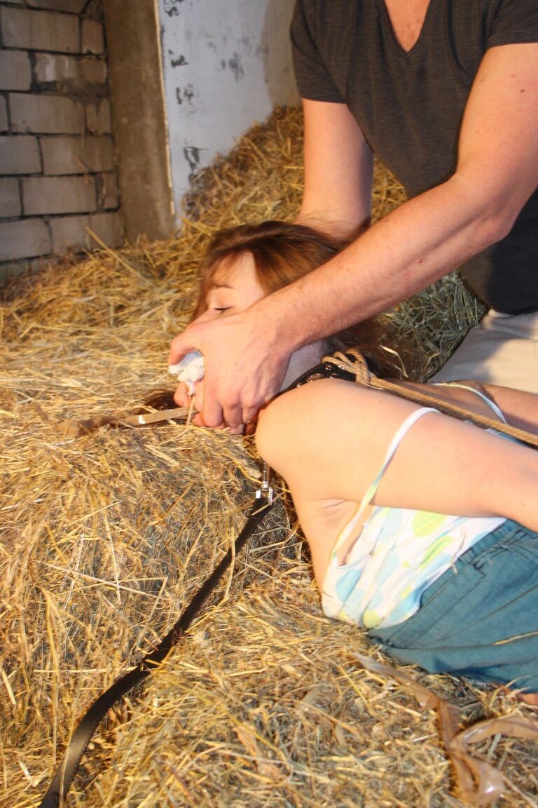 17P Naughty pantiless teen Anouk bound with rope & gagged with tape in the barn