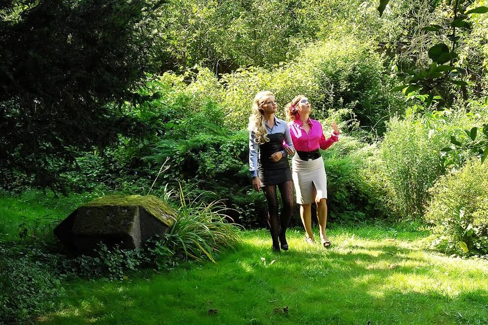 14P Clothed lesbians pleasure each others pussy in a yard with Magic Wands